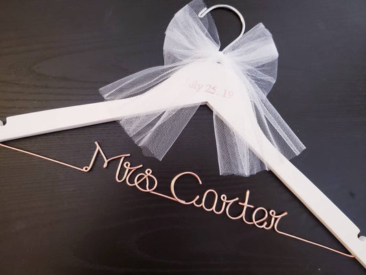 Make Your Wedding Dress Moment Unforgettable A personalized wire hanger that adds a touch of romance to your bridal photos. Designed to be treasured long after the big day.