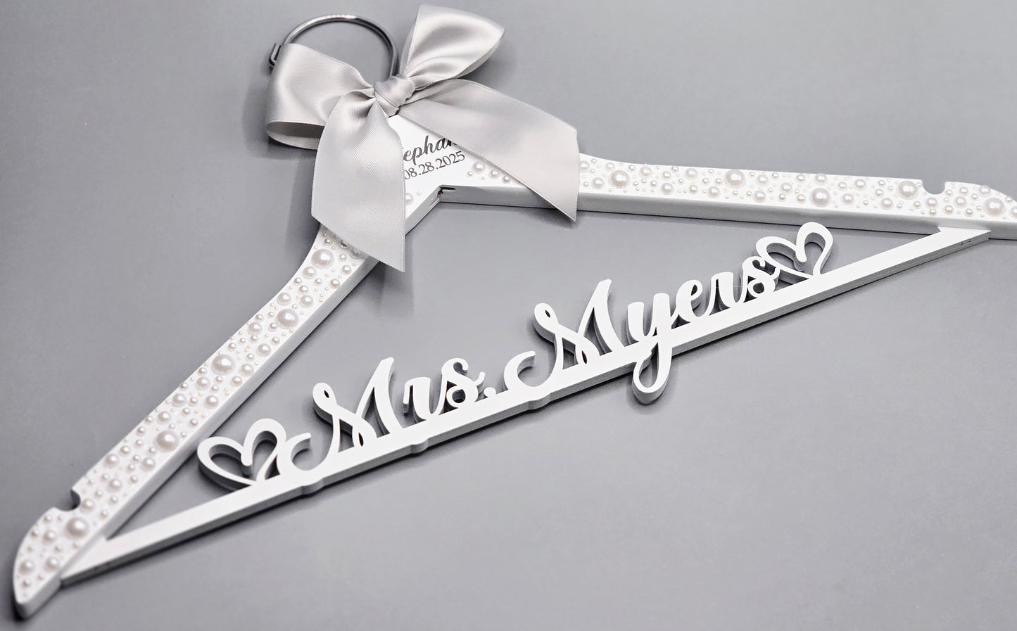 Personalized pearl bridal hanger with silver satin bow and custom name, elegant luxury wedding hanger handmade in U.S.A